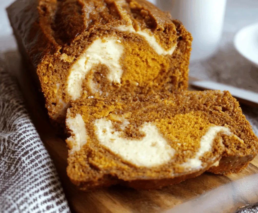 Delicious homemade pumpkin bread with cream cheese swirl, perfect for fall desserts and holiday baking