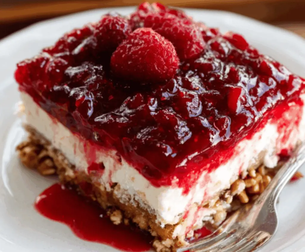Delicious Cranberry Raspberry Pretzel Salad with fresh berries and crunchy pretzels