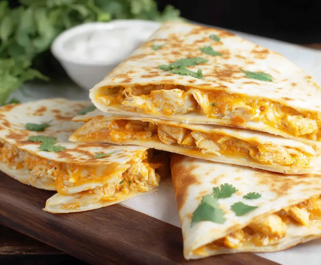 Delicious cheesy chicken quesadillas with melted cheese and crispy tortillas ready to serve.