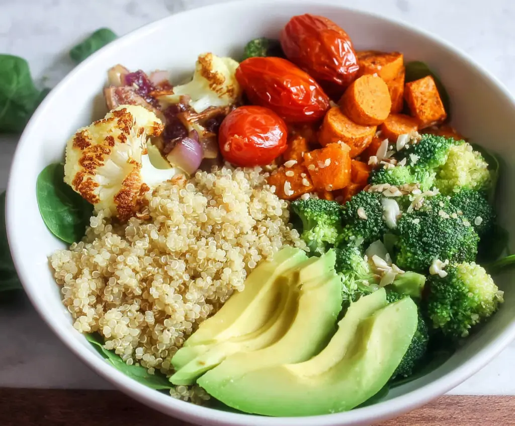 Colorful Clean Eating Quinoa Veggie Bowl with fresh vegetables and herbs.